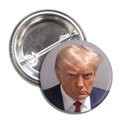 A button with a mugshot image of Donald Trump, showing him in a suit and tie with a serious expression.