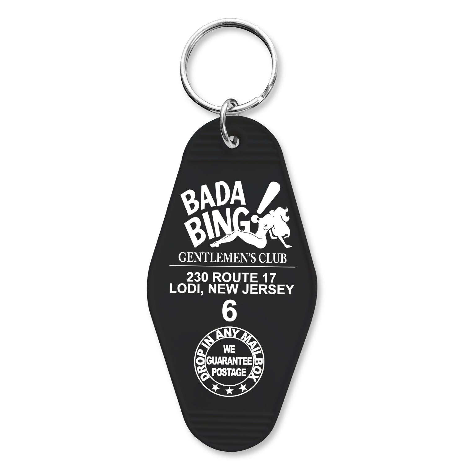 A black keychain with 'BADA BING GENTLEMEN'S CLUB' printed on it and the address 230 ROUTE 17 LODI, NEW JERSEY. There is also a graphic of a mobster and the number 6, referencing the show 'The Sopranos'.