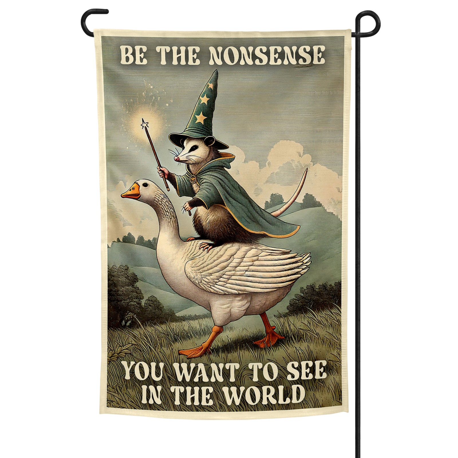 Decorative garden flag with a cartoon owl in a wizard hat riding a goose, featuring text 'Be the nonsense you want to see in the world'.