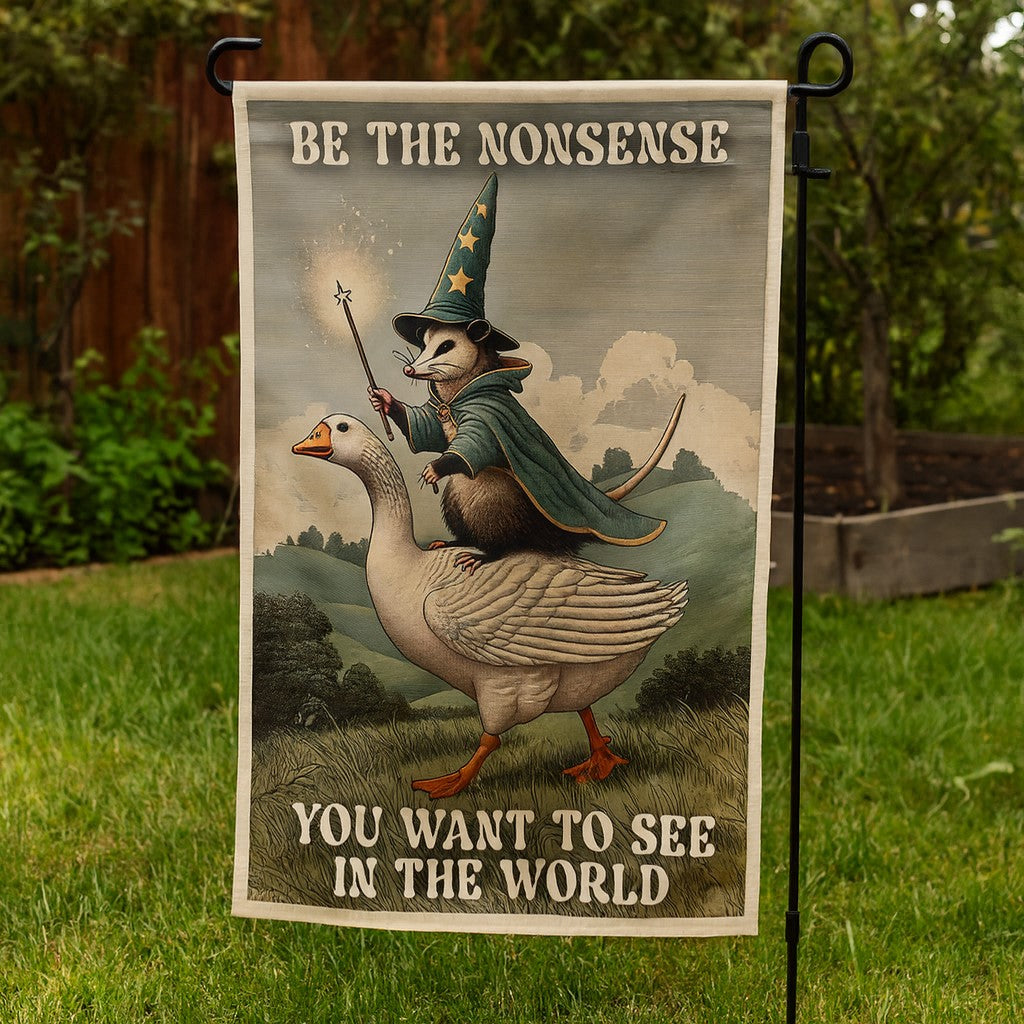 Garden flag with a goose and wizard design on a grassy background