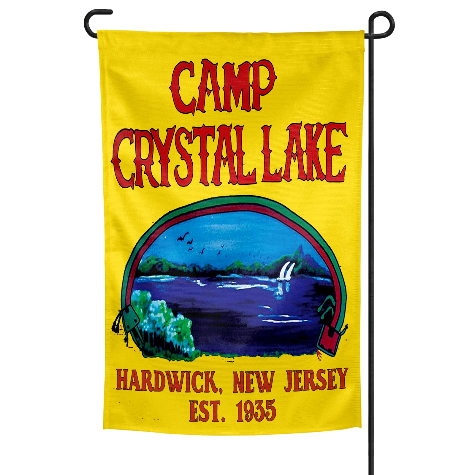 A garden flag with a yellow background featuring the text 'CAMP CRYSTAL LAKE' at the top, a depiction of a lake and forest below, and the text 'HARDWICK, NEW JERSEY EST. 1955' at the bottom.