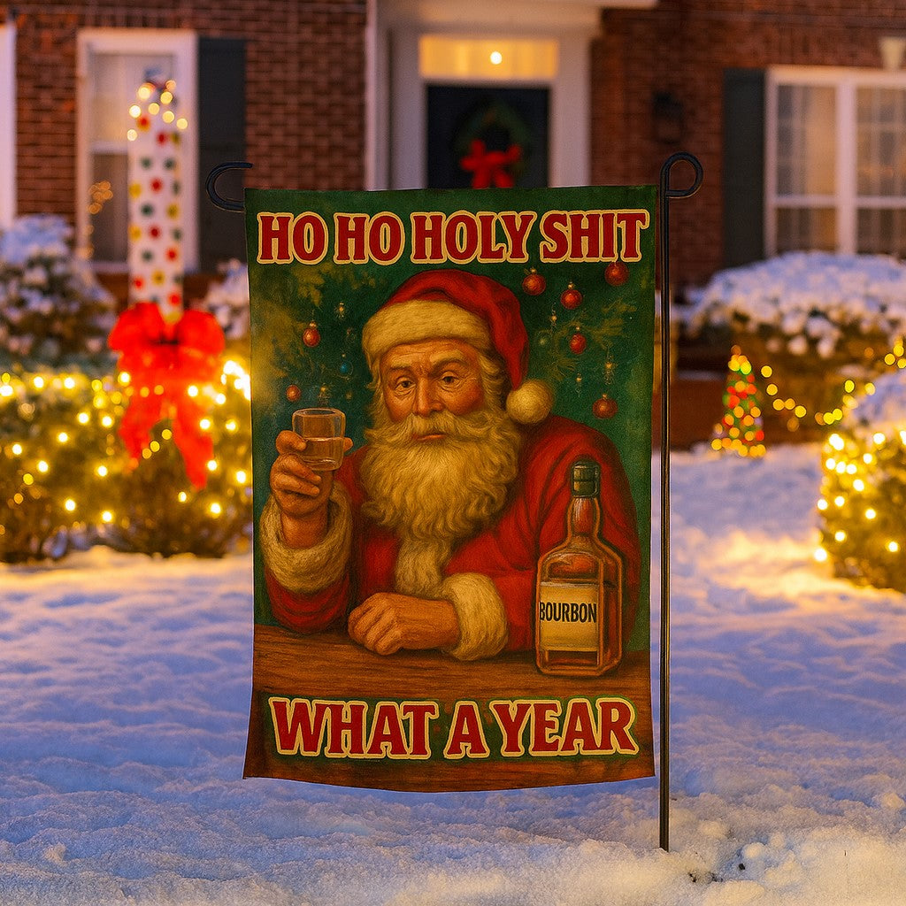 Christmas-themed garden flag with a humorous design of Santa Claus holding a bottle of bourbon, set against a snowy outdoor background.