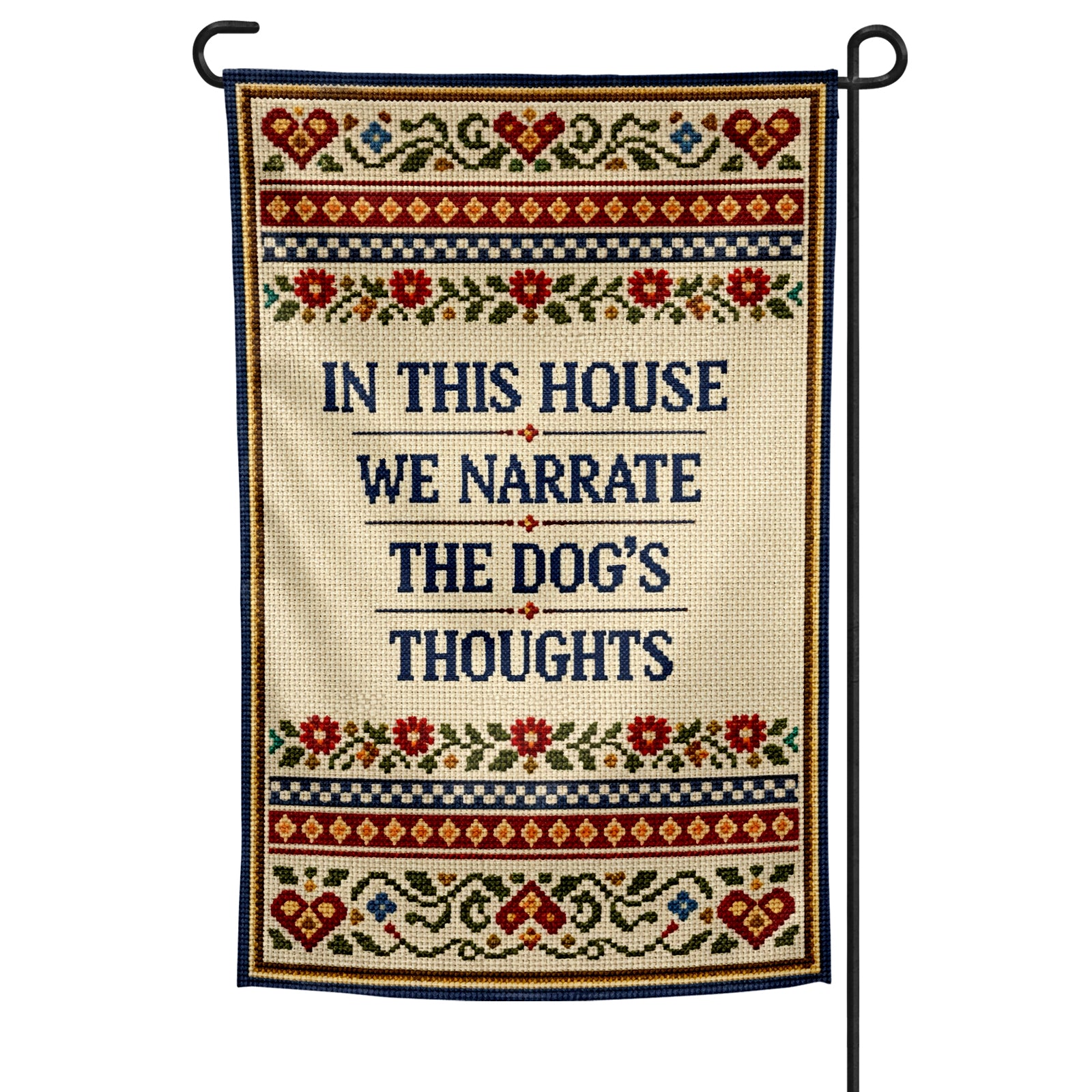 Decorative garden flag with text 'In this house we narrate the dog's thoughts' on a white background