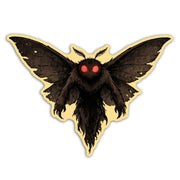 Black moth with red eyes on a beige background
