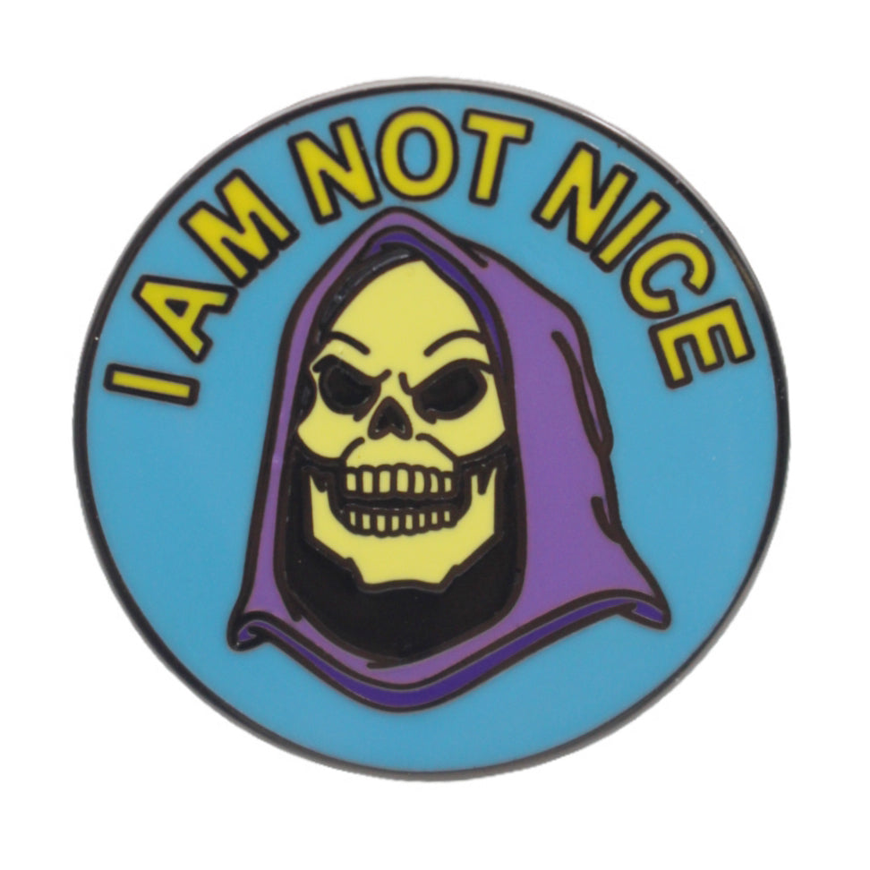 Enamel pin with the character Skeletor from the Masters of the Universe series with the text 'I AM NOT NICE' on a blue background.