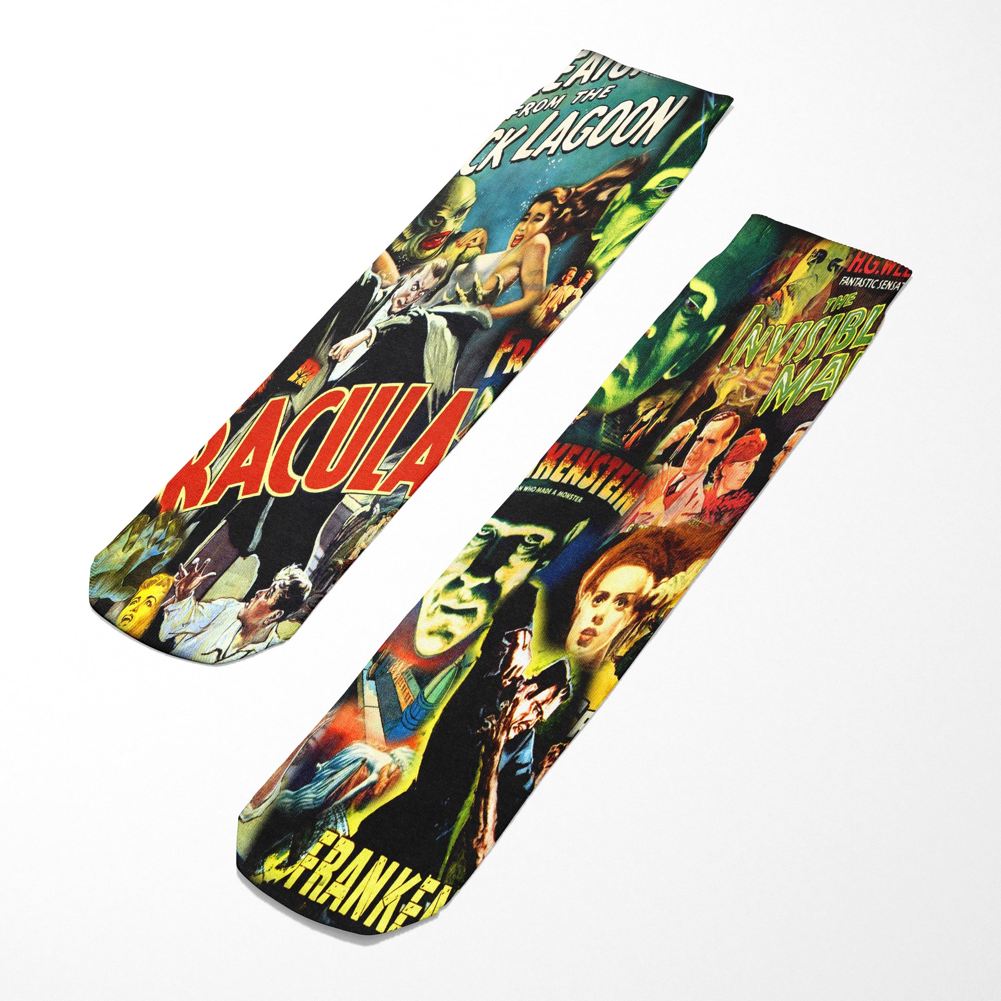 Two socks with vintage monster movie poster designs on a white background