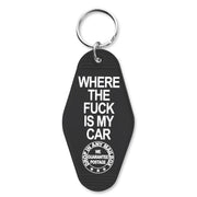 A black keychain with white text 'WHERE THE FUCK IS MY CAR' printed on one side, featuring a metal split key ring.
