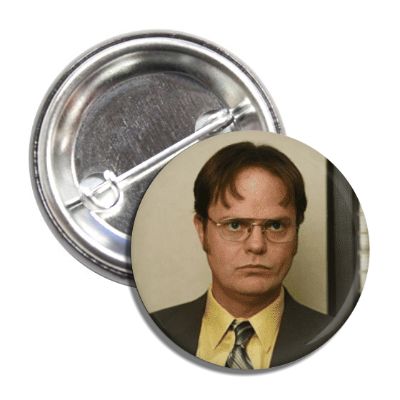 A round pin-back button featuring an image of Dwight Schrute from the TV show The Office.
